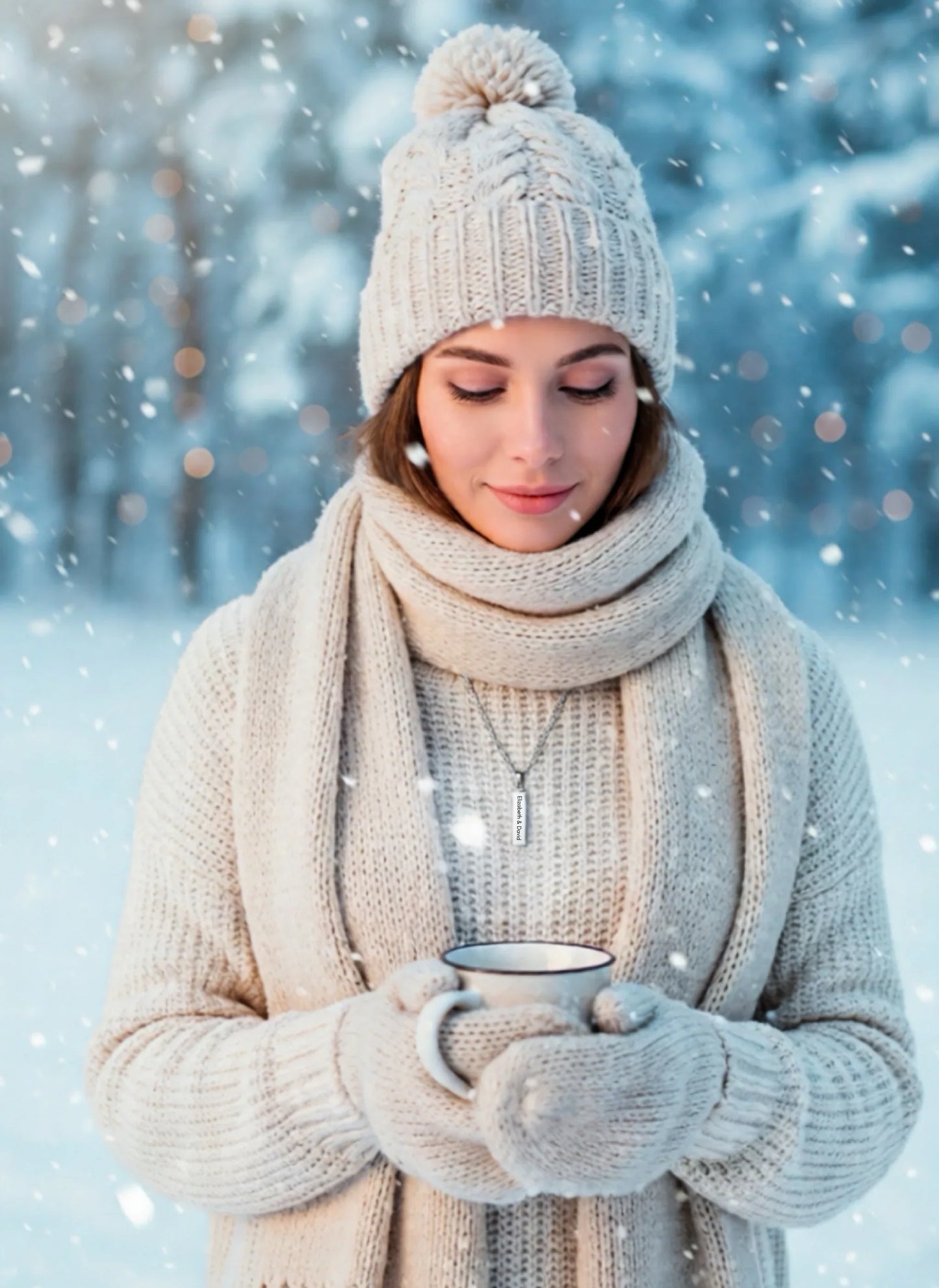 Woman wearing beige knit hat, scarf, and mittens holding a cup in snowy outdoor winter setting