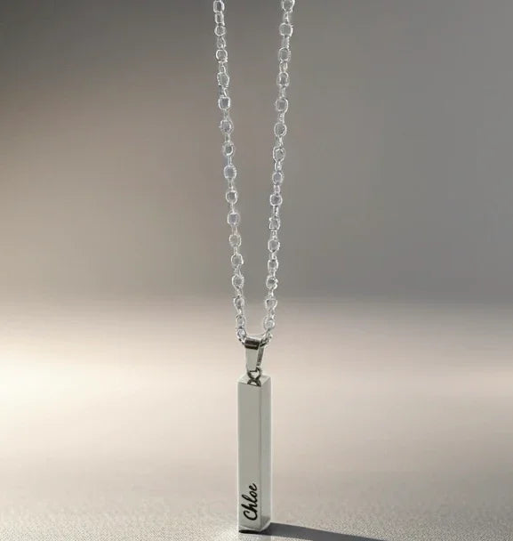 Silver vertical bar pendant necklace engraved with name Chloe on delicate chain