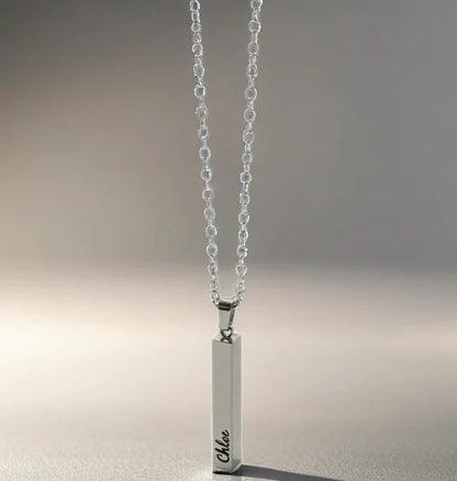 Silver vertical bar pendant necklace engraved with name Chloe on delicate chain